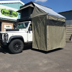 A white truck parked in front of bundtec.