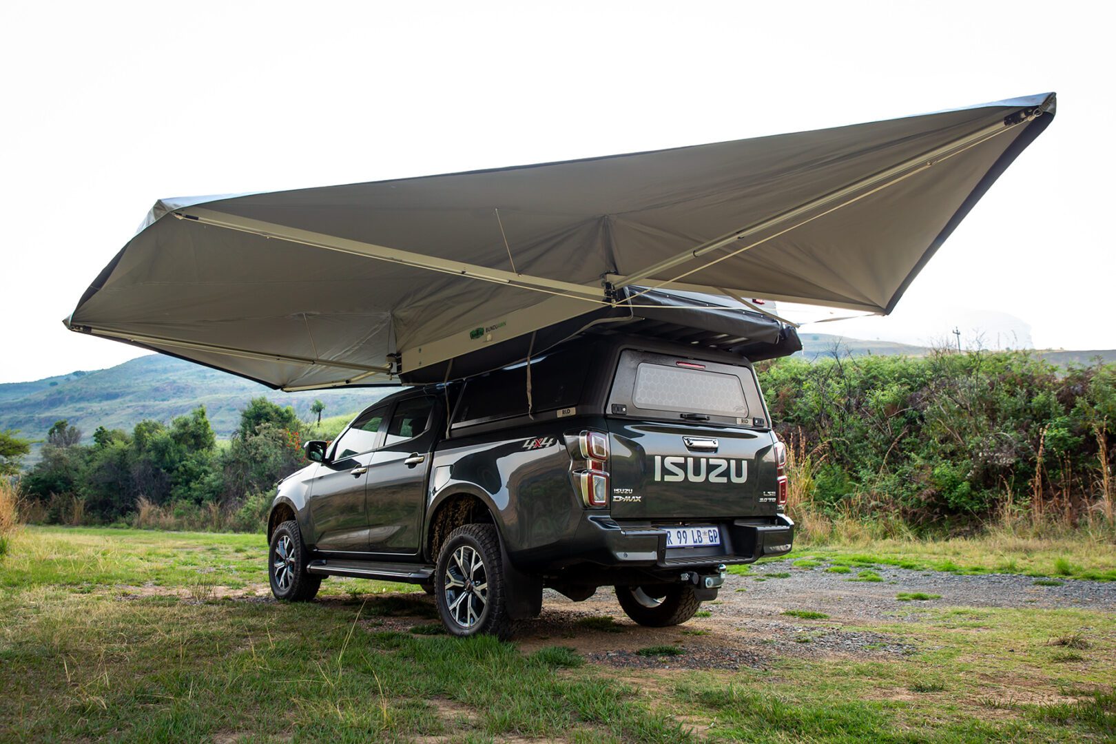 A large truck with an awning attached to it.