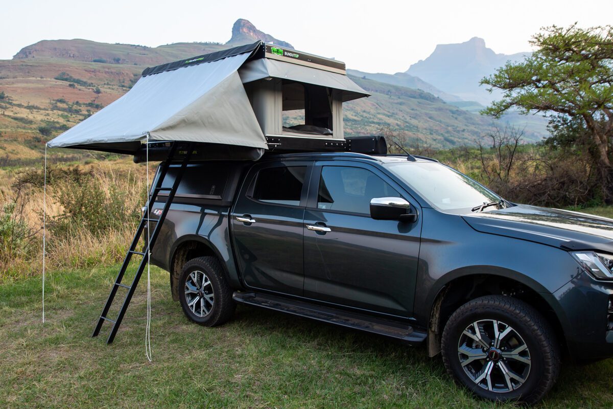 A truck with an awning on top of it.