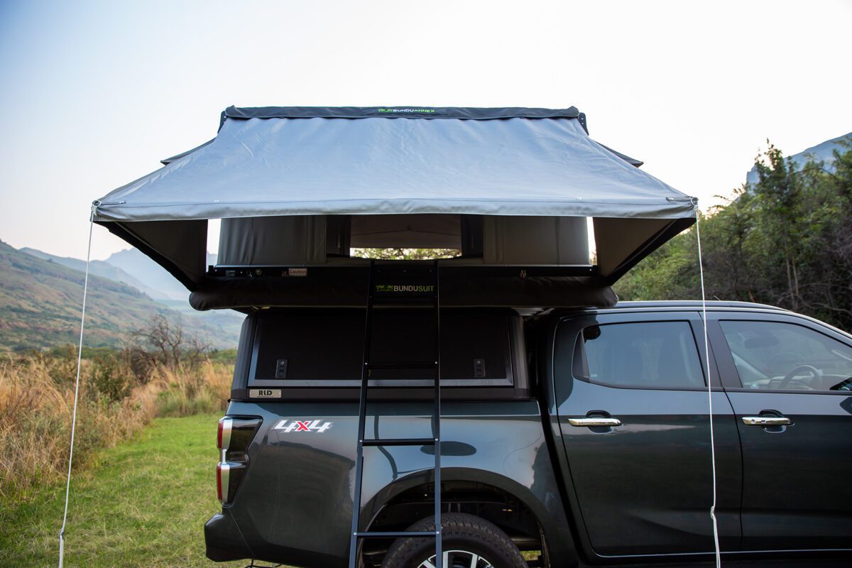 A truck with an awning on the back of it.