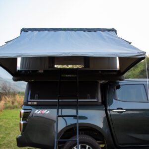 A truck with an awning on the back of it.