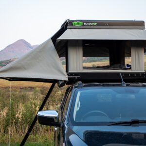 A car with an open roof and the top opened.