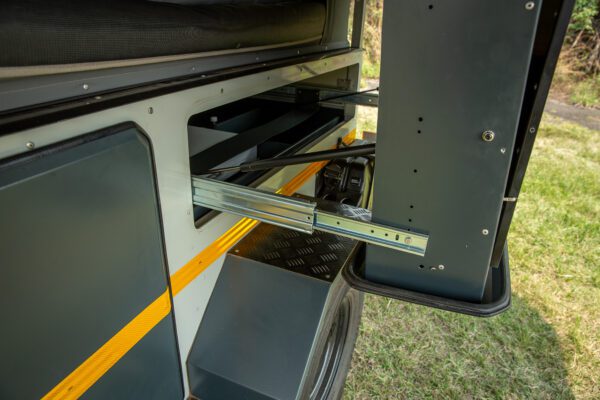 A close up of the door and side rails on an rv.