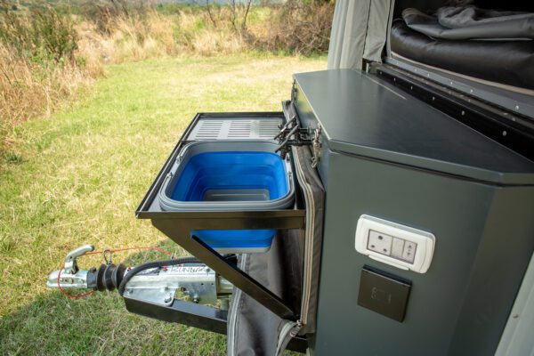 A cooler compartment in the back of an rv.