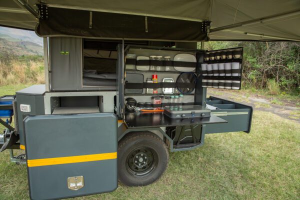 A truck with an open door and a large compartment.