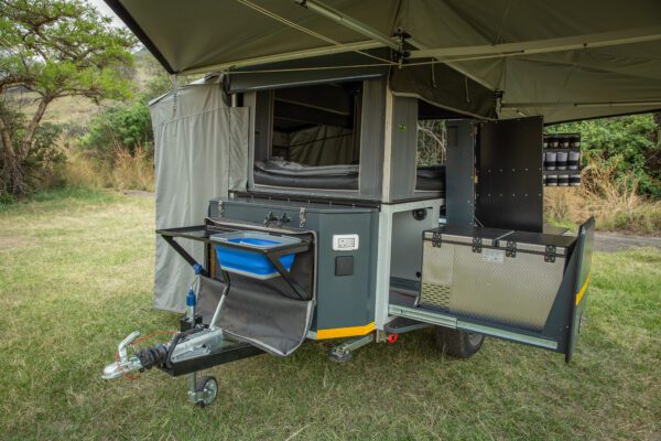 A trailer with an open door and the back of it.