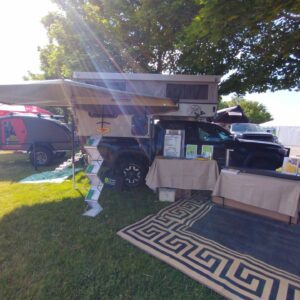 A camper van with a canopy and awning