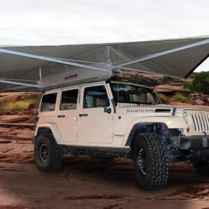 A jeep is parked on the side of a road.