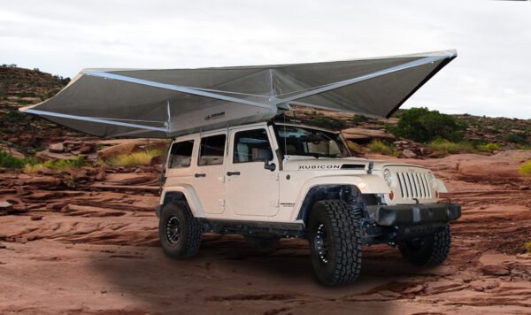 A jeep is parked on the side of a road.