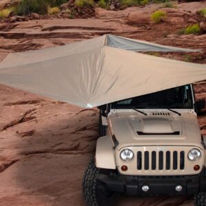 A jeep with an umbrella attached to it.