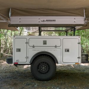 A white trailer with a canopy on top.