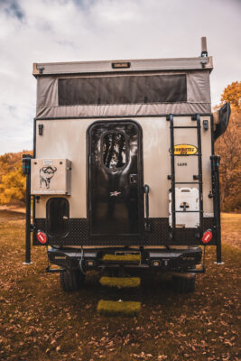 A truck with a tent on the back