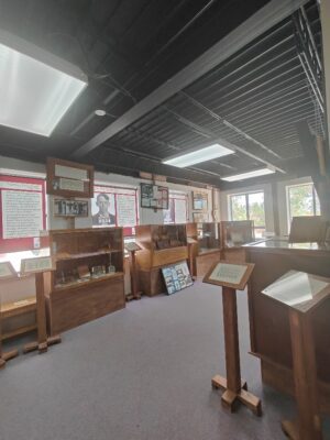 A room filled with lots of wooden shelves.