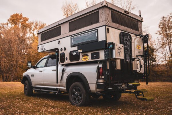 A truck with a camper attached to it.