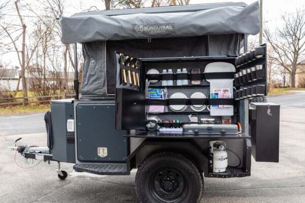 A camper trailer with a kitchen on it.