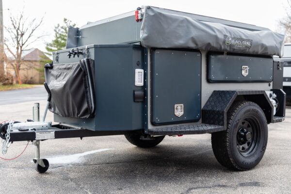 A trailer with a camper attached to it.