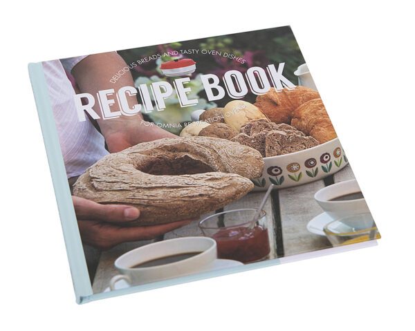 A Color Cookbook with a picture of bread and a cup of coffee.