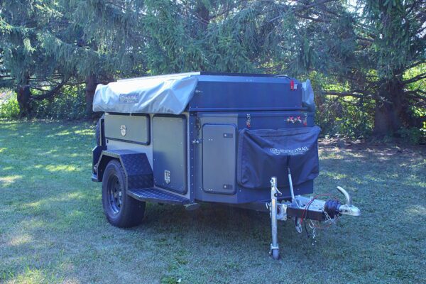 A trailer with a camper attached to it.