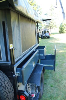 The back of a jeep with a storage compartment.