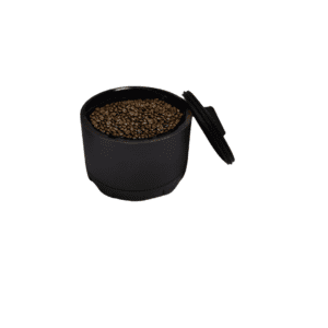 Black container with roasted coffee beans.