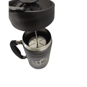 Black French press coffee maker with lid off.