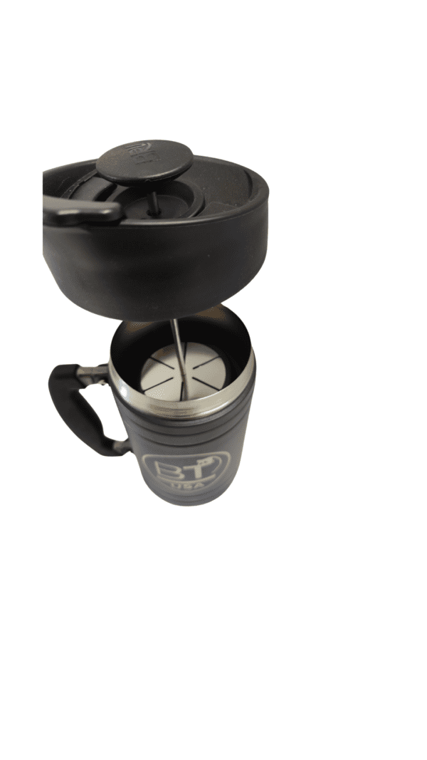 Black French press coffee maker with lid off.