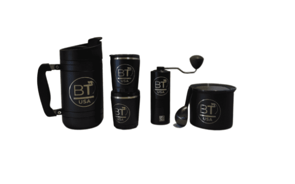 Black coffee mugs and grinder with logo.