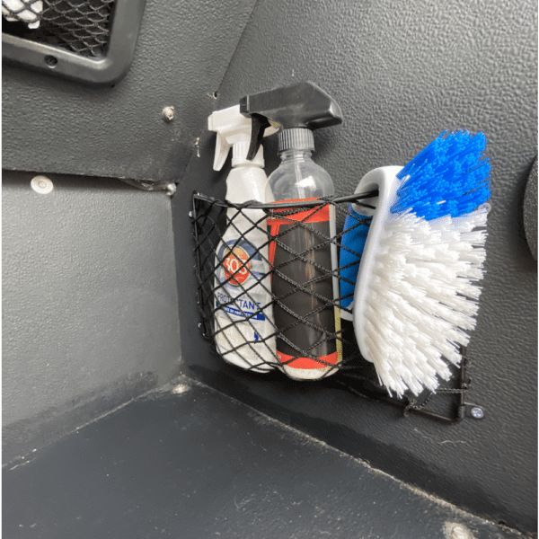 Cleaning supplies and brush in a car.