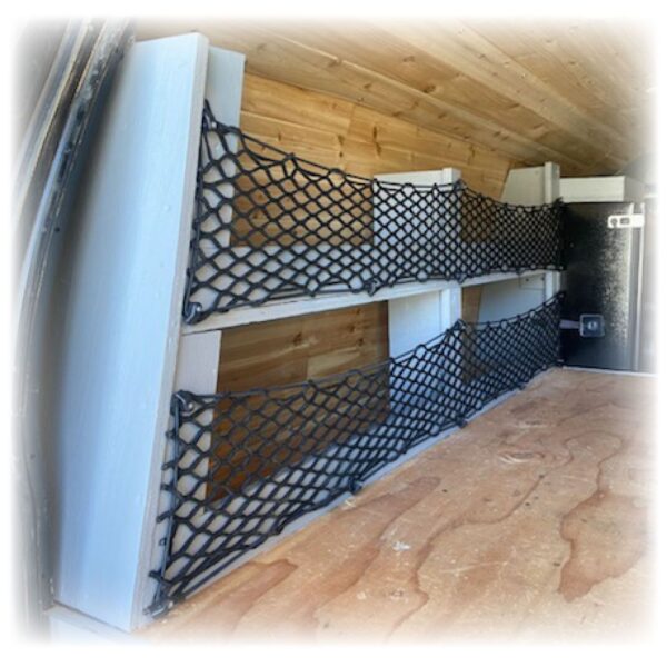 Black cargo nets in a wooden van.