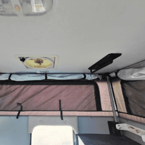 White van ceiling with pop-up tent.