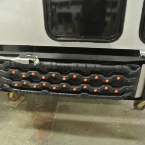 Black rubber step with orange accents.