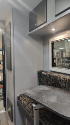 RV interior with table and seating area.