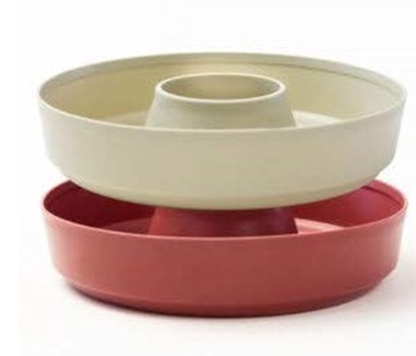 Stacked round baking pans, beige and red.